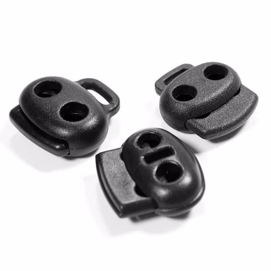 Tapón de cordón de plástico blanco y negro, doble orificio ajustable, alta calidad, bloqueo de cordón ovalado de resorte